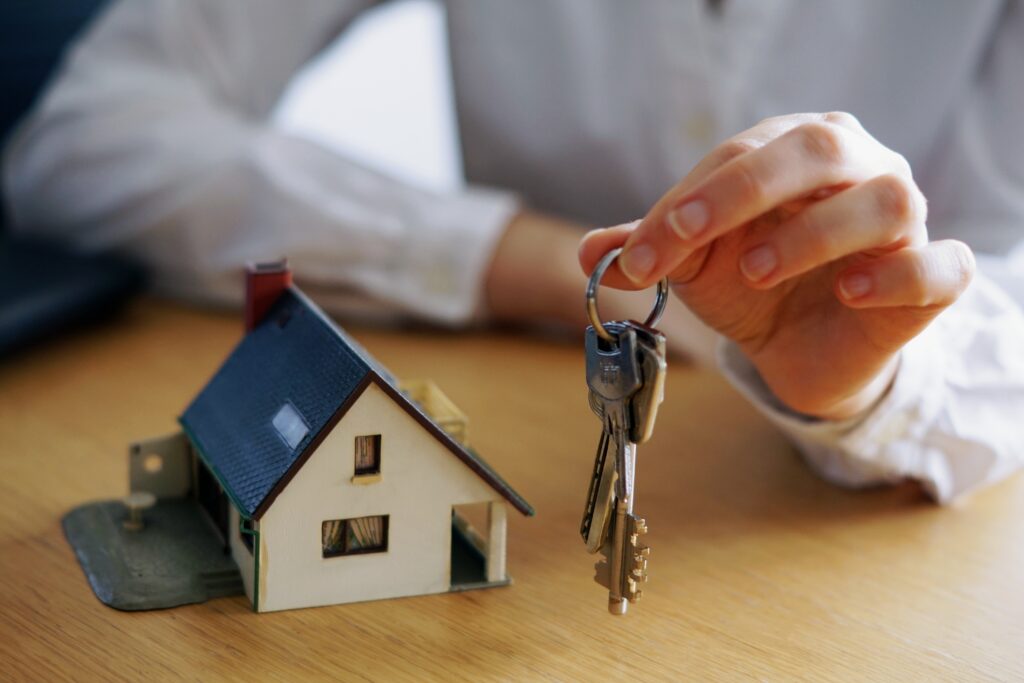 closeup shot of a person thinking of buying or selling a house